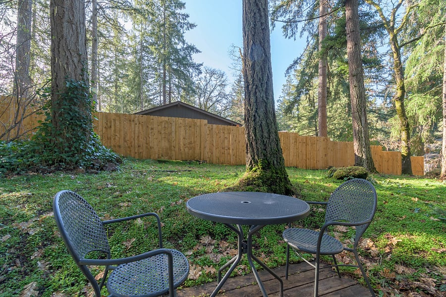 Small deck outside dining area with table and chairs to enjoy your morning coffee