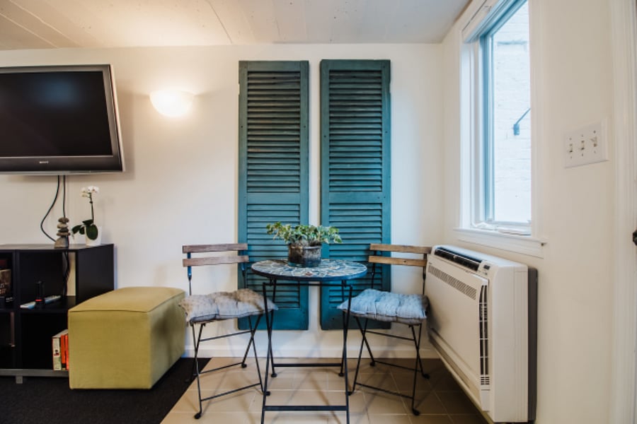 Dining/work space. Cafe table can be replaced with 3x3 foot card table.