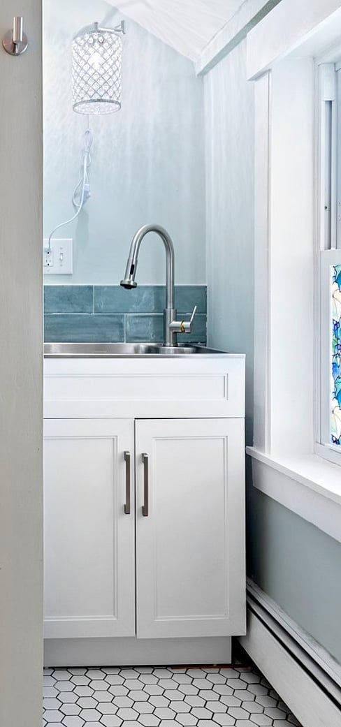 Separate sink in a sunny corner for glassware and kitchen items.