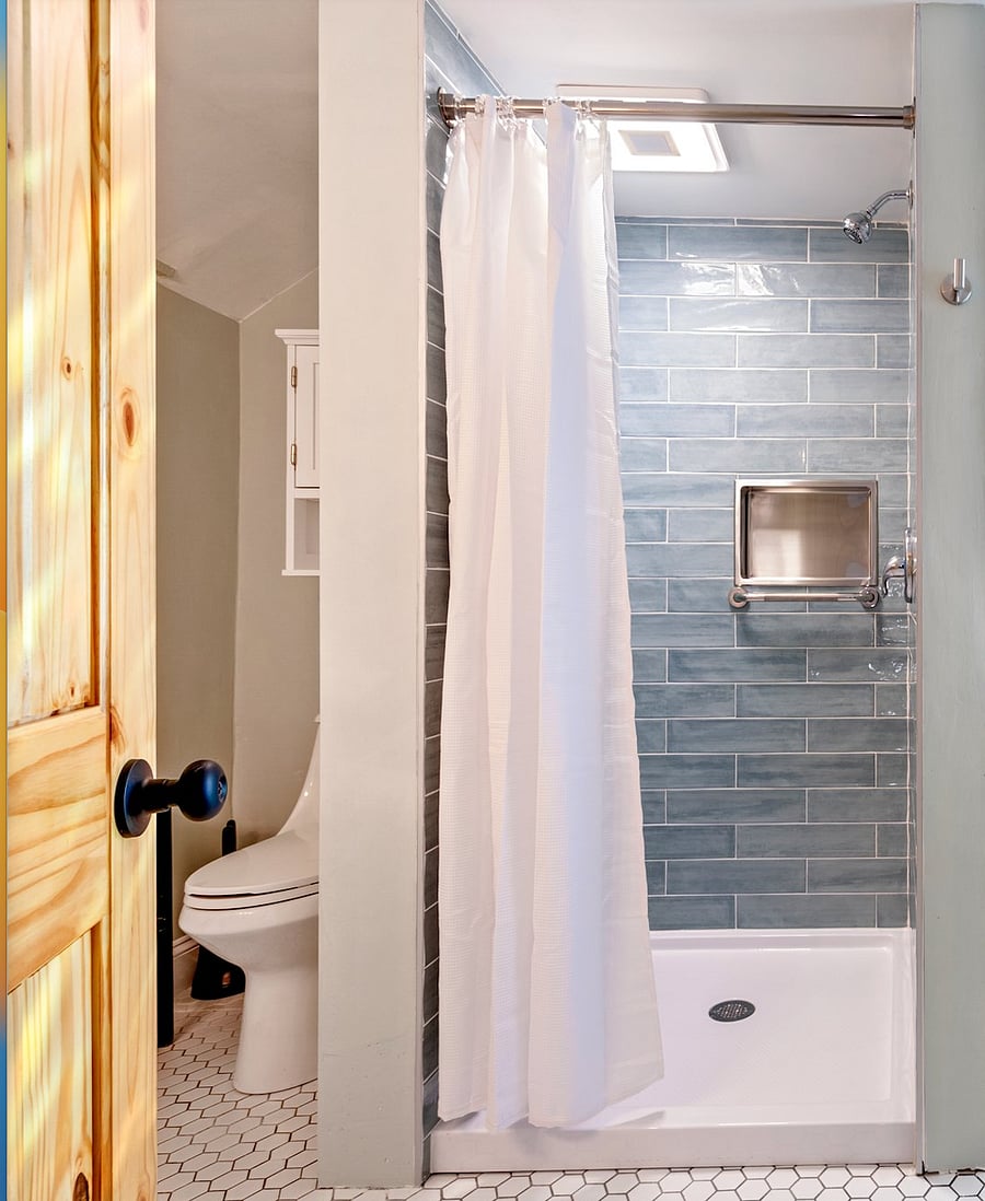 Spacious bathroom with shower.