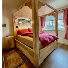 Bedroom #1 beautiful crafted Blue Pine canopy queen bed, closet, desk & TV.
