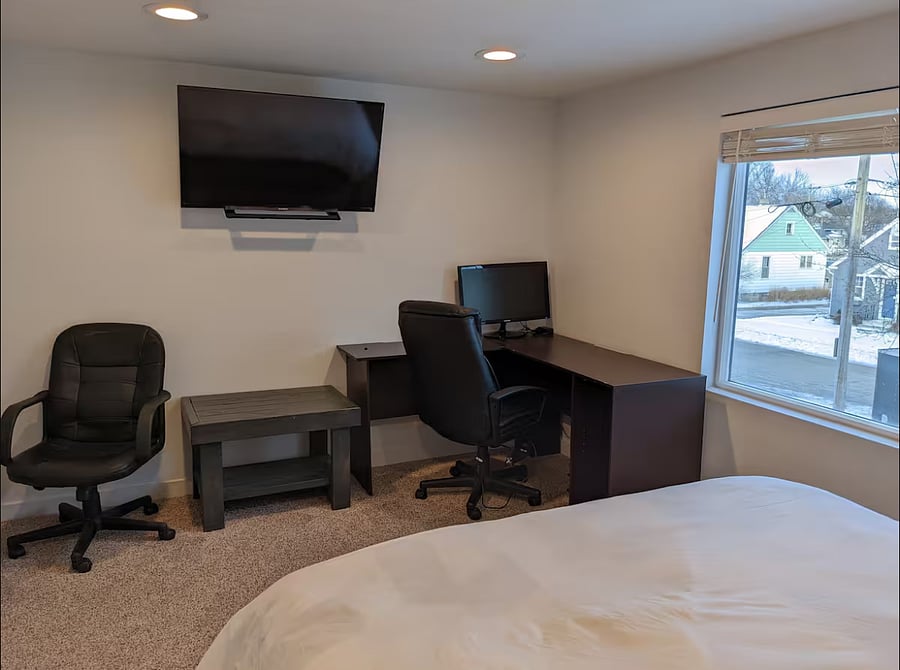 2nd bedroom has a desk setup, great for remote work.
