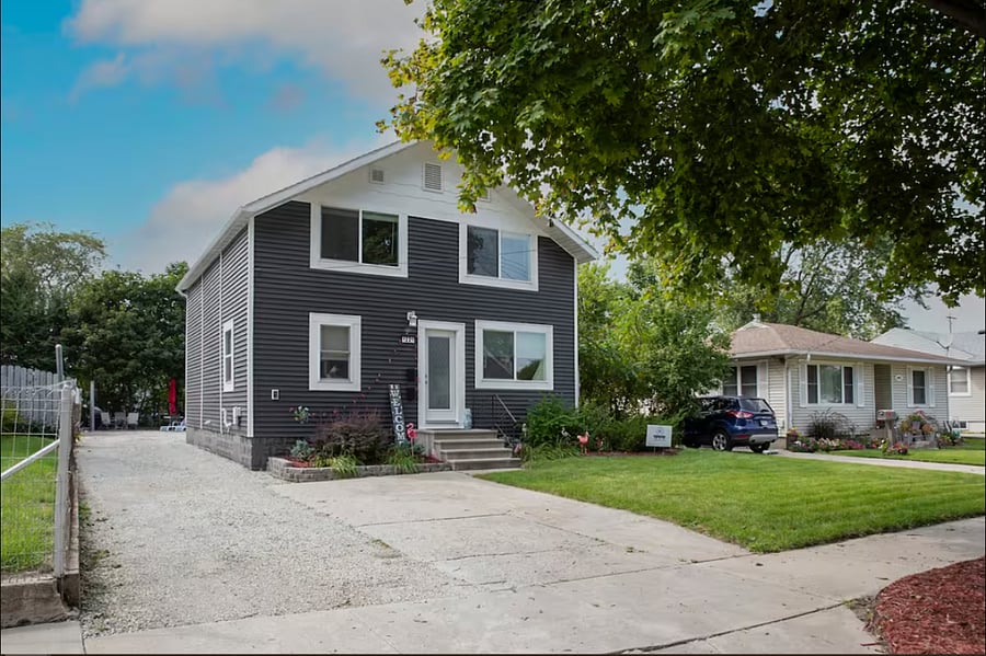 The cement spot is yours to park in at any time. You'll enter through the front door, where you'll find the entryway to the upper unit (Door 2).