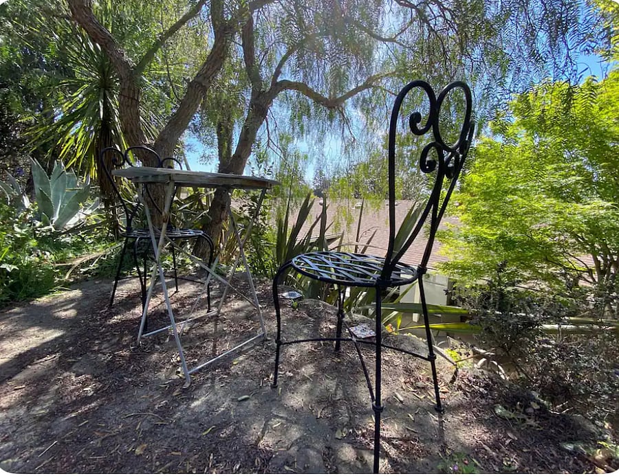 Guest Favorite! Walk up a winding little trail in the terraced backyard, and you reach this cute caf table with a view of Mount Tam, and a sliver of the blue Bay! Very peaceful spot for your coffee, tea, meditation, journaling, and just being.