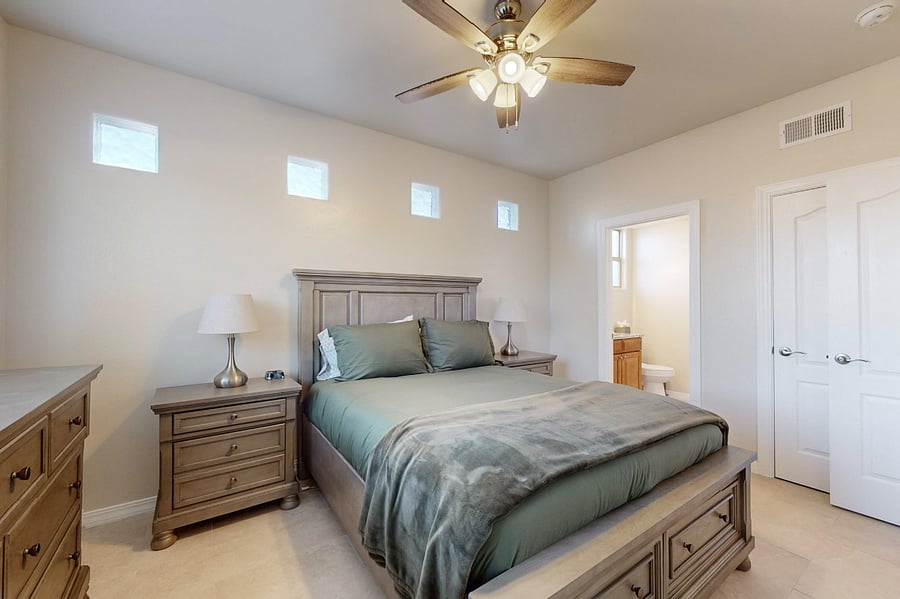 Relax in this inviting secondary ensuite, featuring a brand-new queen bedroom set, Smart RokuTV, and a private bathroom, offering comfort and privacy for a perfect stay.