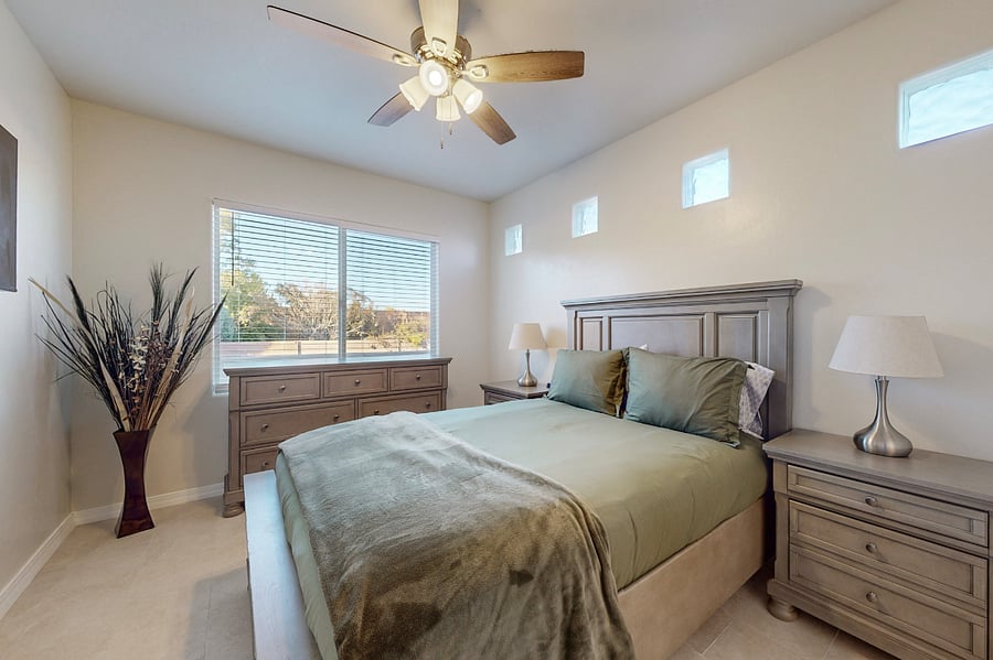 Relax in this inviting secondary ensuite, featuring a brand-new queen bedroom set, Smart RokuTV, and a private bathroom, offering comfort and privacy for a perfect stay.
