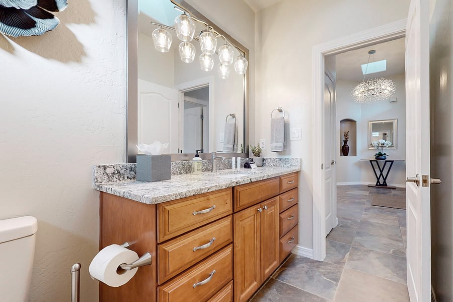 The main full bathroom features a bathtub and shower, serving as a shared community bathroom for guests and providing convenient access for those staying in the adjacent bedroom three.
