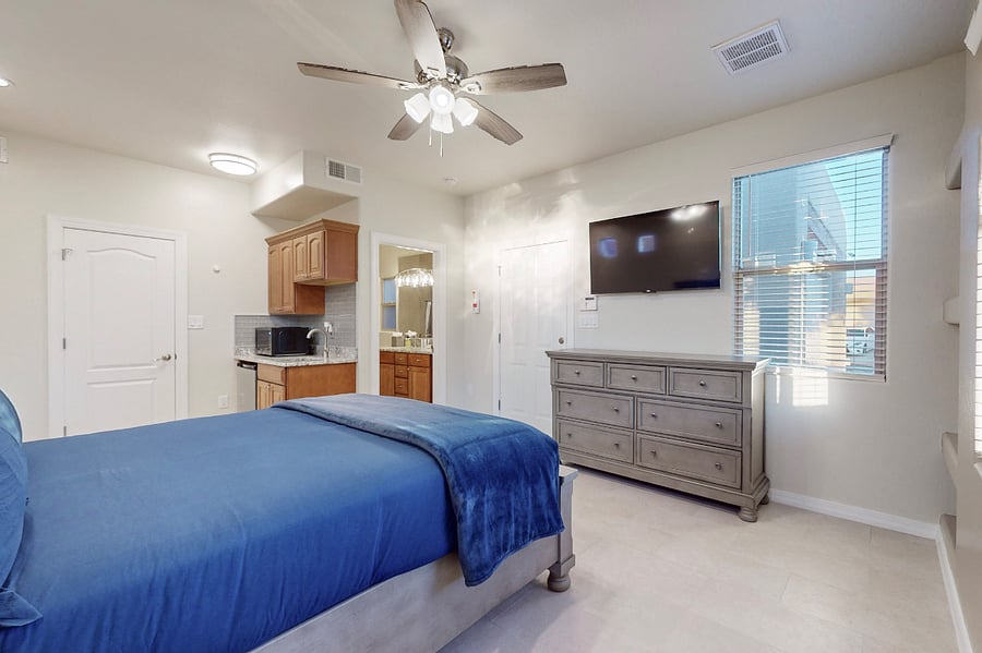 Unwind in this bright cozy casita featuring a comfortable queen bed, ample storage, a private kitchenette and full bathroom, Roku Smart TV; perfect for relaxing after a day of work or family fun.