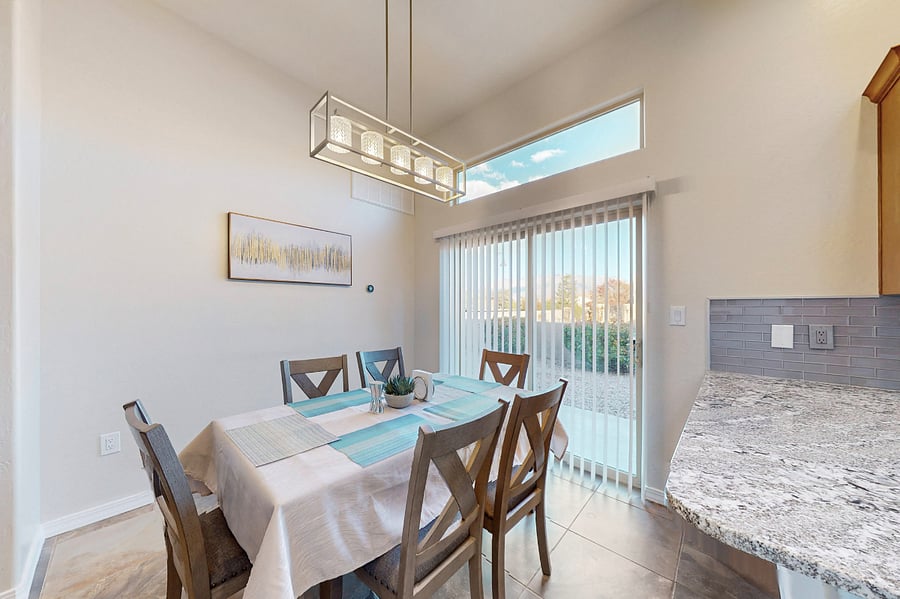 Gather around this spacious dining table, perfect for enjoying family meals, game nights, and sharing memories together during your stay. The open floor plan means you can all be together whether you are in the living room, dining room, or kitchen.