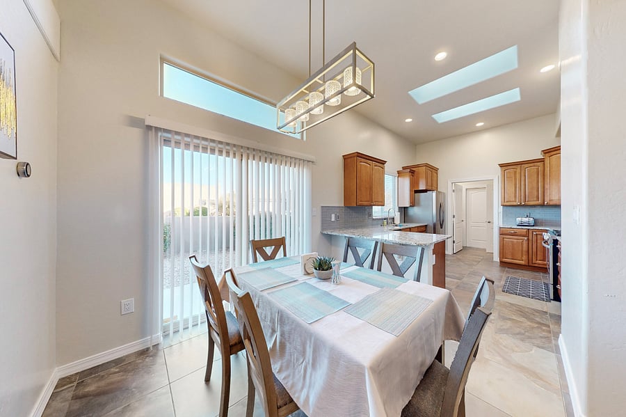 Gather around this spacious dining table, perfect for enjoying family meals, game nights, and sharing memories together during your stay. The open floor plan means you can all be together whether you are in the living room, dining room, or kitchen.