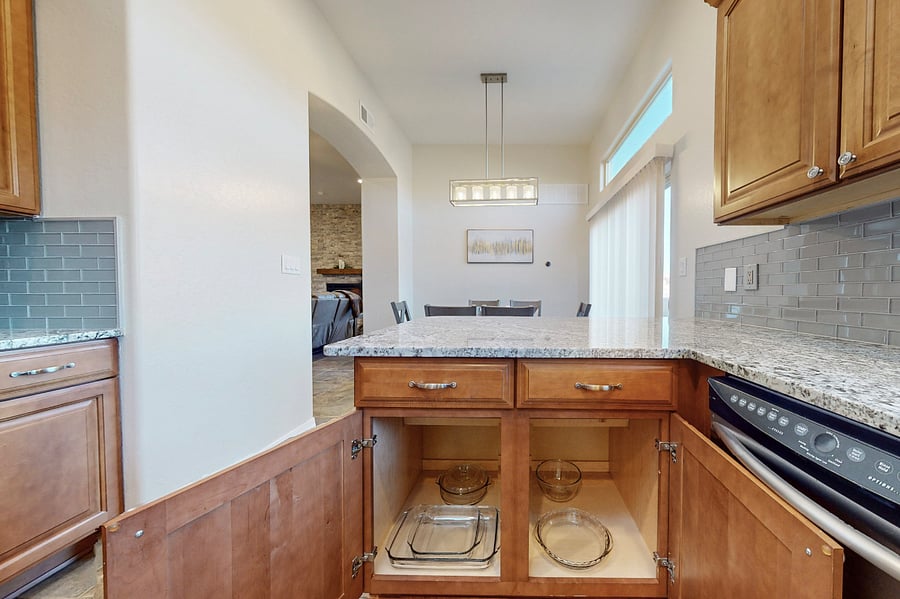 This modern kitchen is fully stocked with both small and large appliances, providing everything you need to prepare breakfast, lunch, dinner, dessert, and all the snacks you desire.