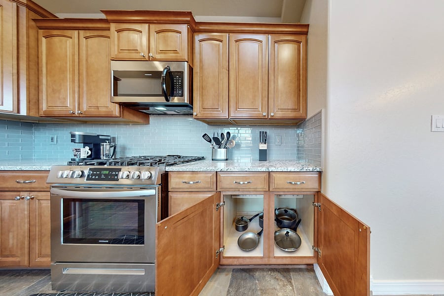 This modern kitchen is fully stocked with both small and large appliances, providing everything you need to prepare breakfast, lunch, dinner, dessert, and all the snacks you desire.
