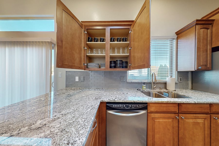 This modern kitchen is fully stocked with both small and large appliances, providing everything you need to prepare breakfast, lunch, dinner, dessert, and all the snacks you desire.