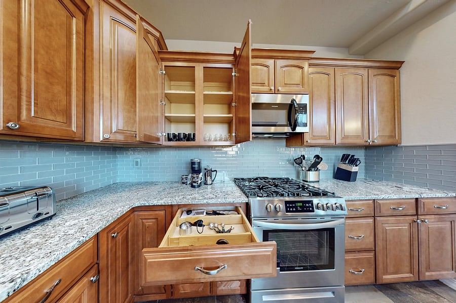 This modern kitchen is fully stocked with both small and large appliances, providing everything you need to prepare breakfast, lunch, dinner, dessert, and all the snacks you desire.