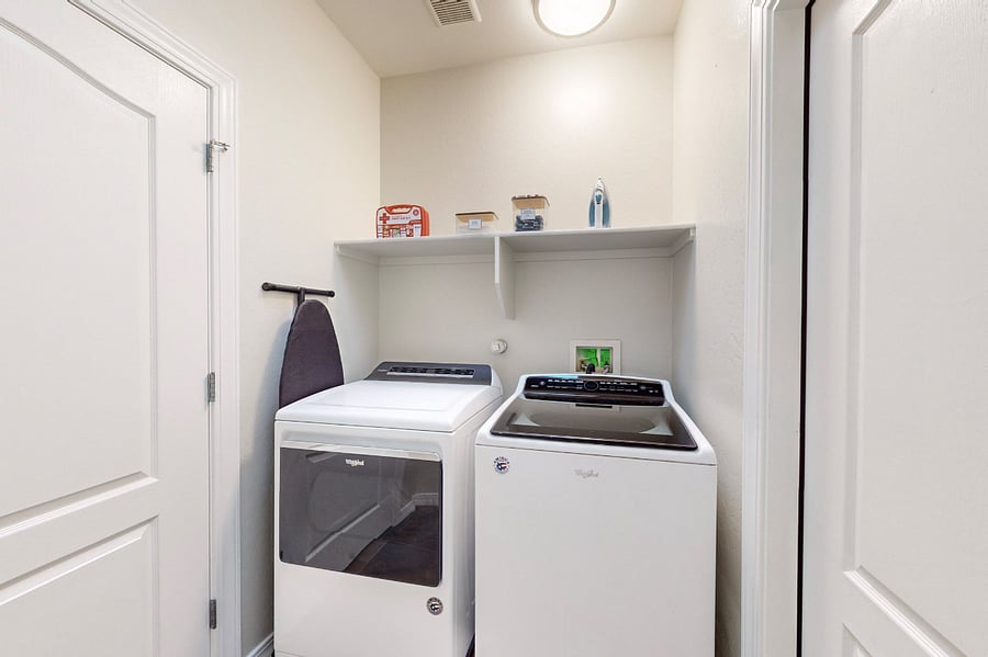 The laundry room is equipped with a washing machine, dryer, iron, and ironing board, for your convenience during your stay. Whether youre refreshing your wardrobe or tackling a big load, this space has you covered.