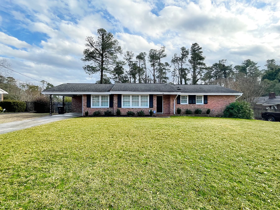 Front of the home, it has an entrance in the carport and the front door