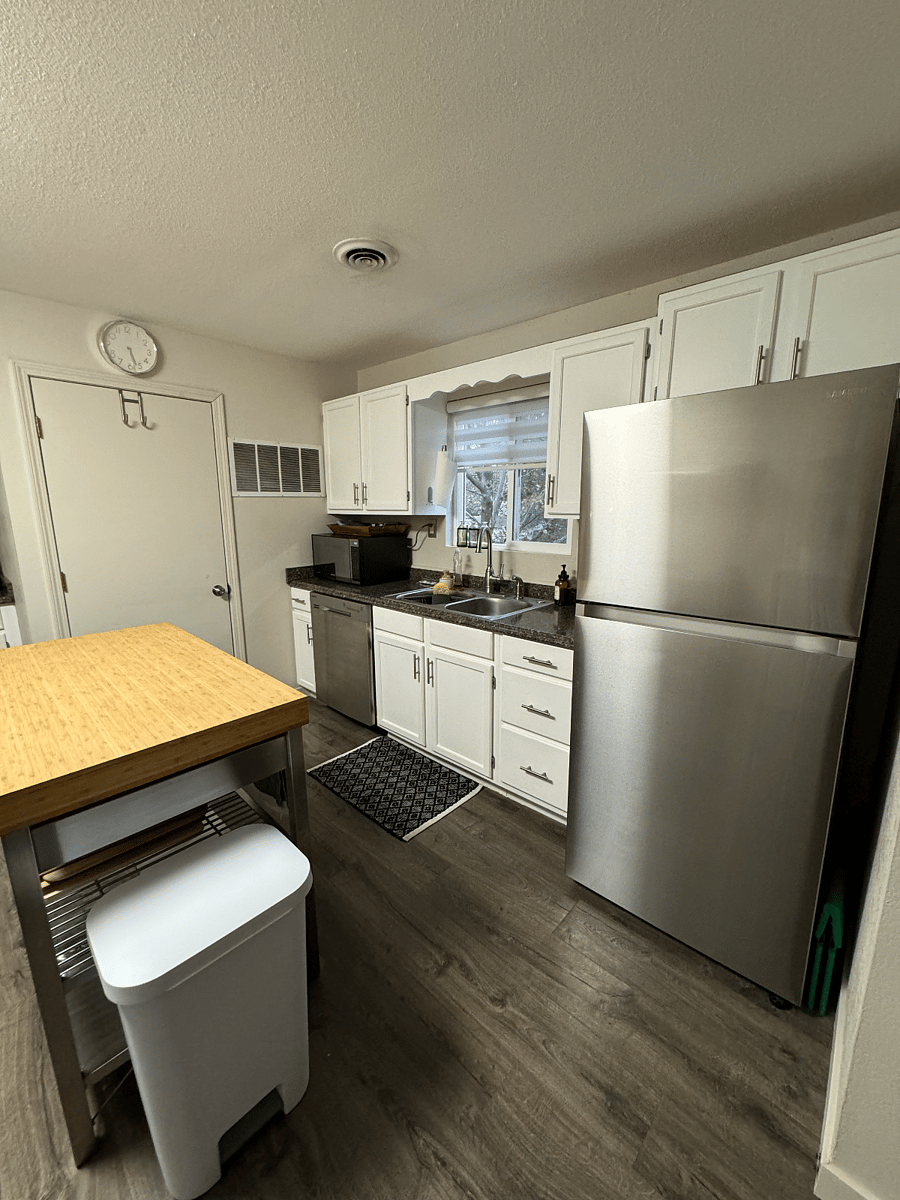 Kitchen features views to trees outside