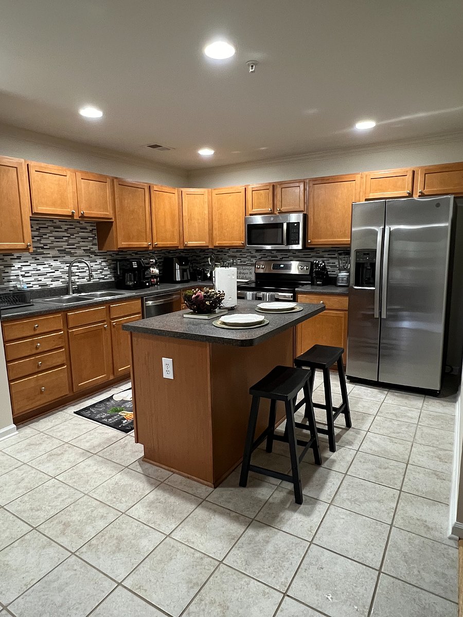 Kitchen island for casual eating. Plenty of dishes available including, cups, mugs, wine glasses, bar glasses, plates, bowls, cutlery, cooking spoons, spatulas, knife, pots, pans, bakeware, ect. Everything you might need is here.  