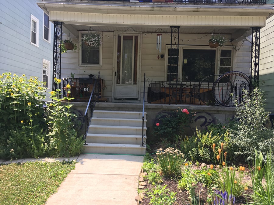 The front of house entrance in the summer