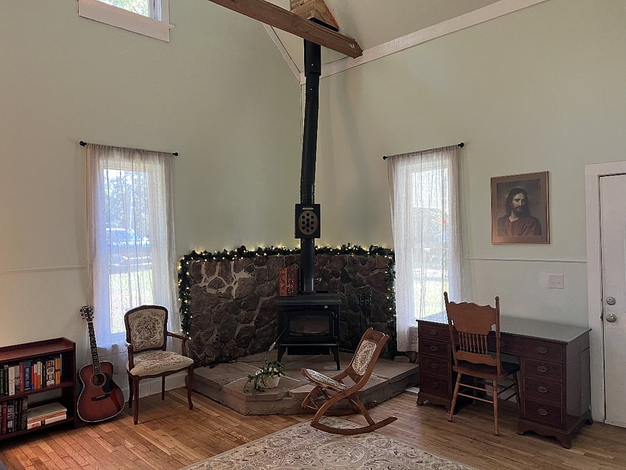 The main entrance to the farmhouse leads into this large living room with functional wood-burning stove.  This space is shared with the owner's apartment, but guests are welcome to enjoy the space as they wish.