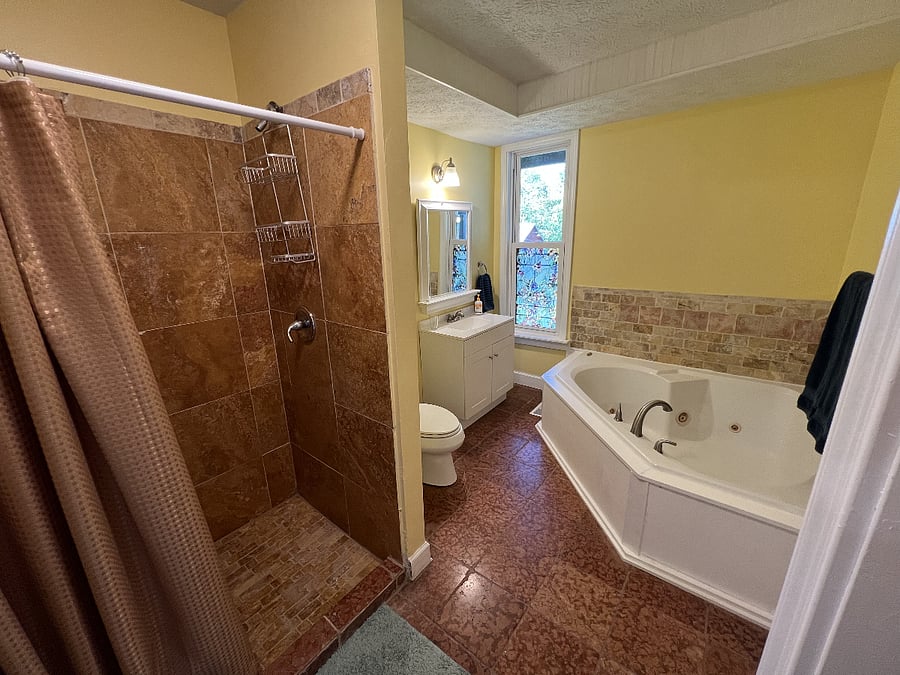 In addition to the soaking tub, your private bathroom features this large walk-in shower.