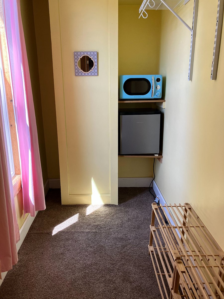 The private bedroom space features this large walk-in closet with room for all your clothes, suitcase storage, etc.  It also features a mini-fridge and microwave so you can keep & heat essentials in your suite when you don't feel like walking to the kitchen!