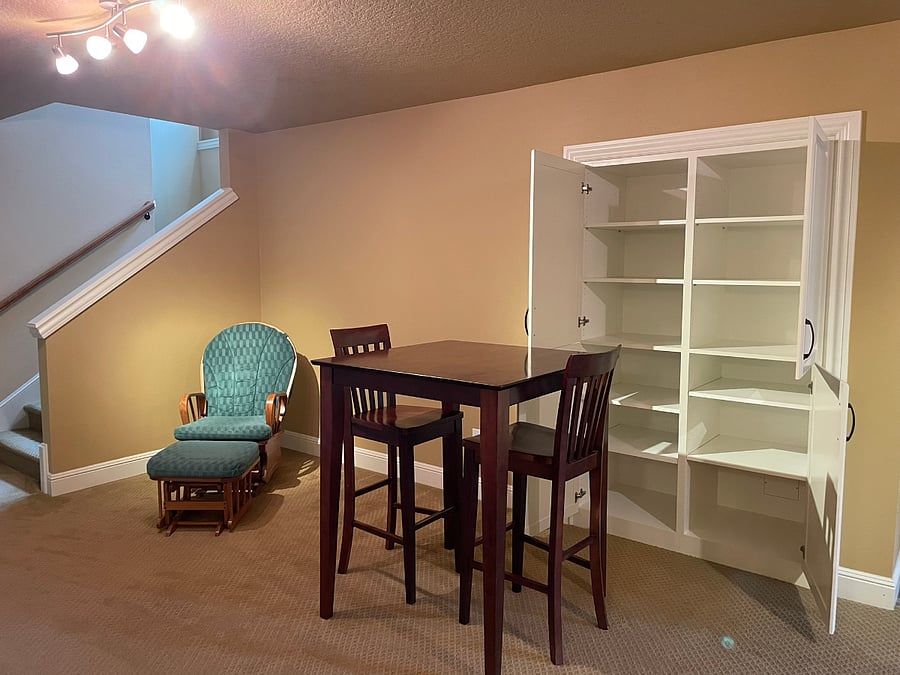 Ample storage space. Stairs to upper main level greater room and main entrance. 