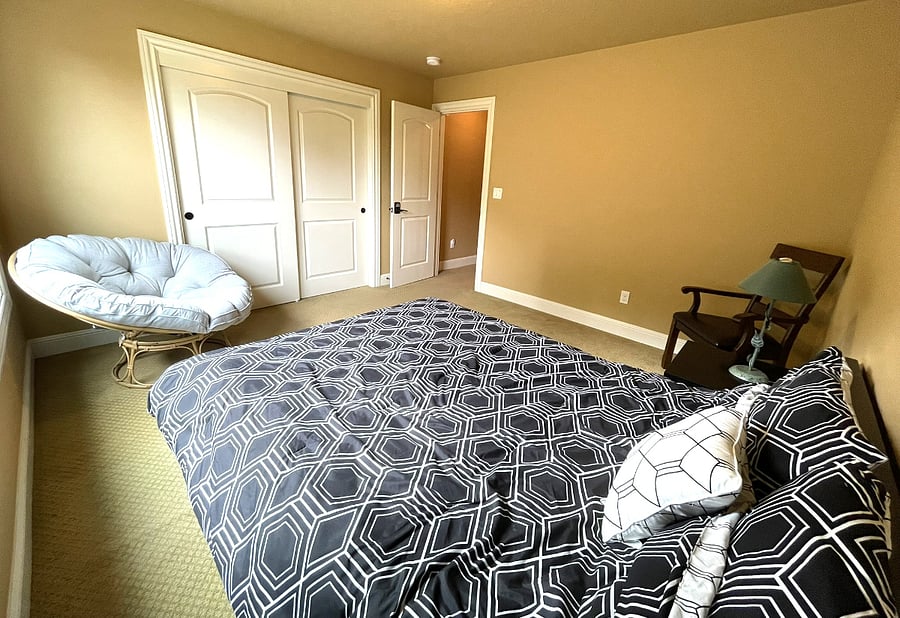 Queen size bed with side table and conformable sofa and chair.
Large closet.