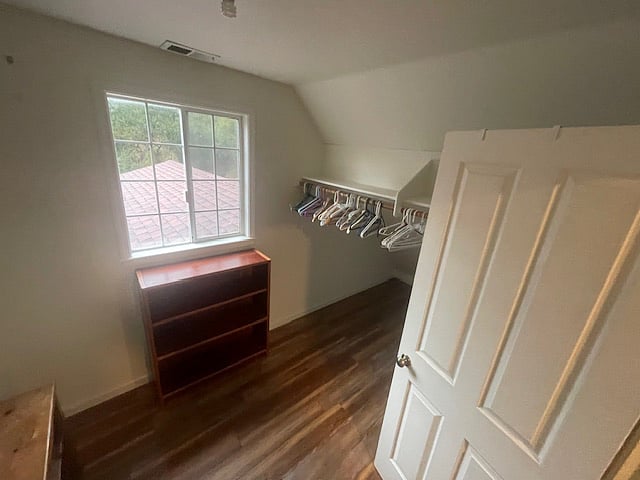 one of two walk-in closet spaces
