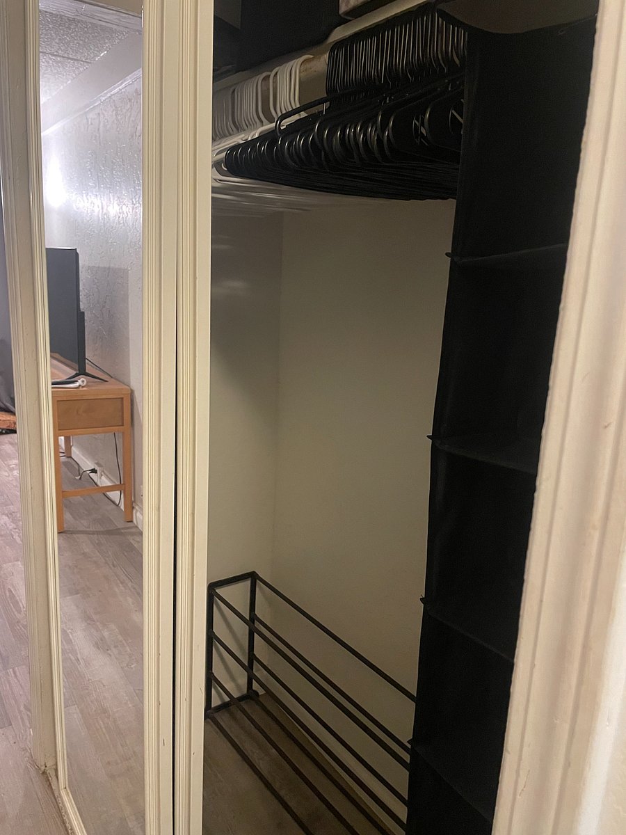 Closet with Hangers, Hanging Cubbies, and Shoe Rack. Not Pictured is shelf above Hanging Rod