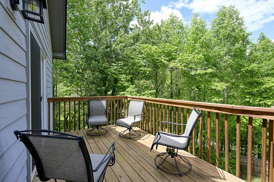 outdoor deck off the kitchen overlooking backyard. 
