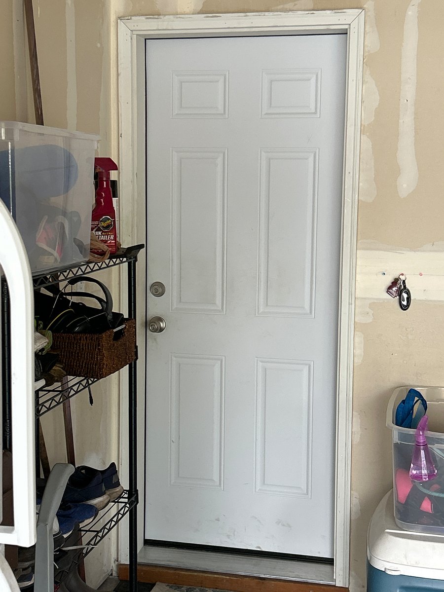 Garage entrance to home. Two remotes for well insulated garage door.
