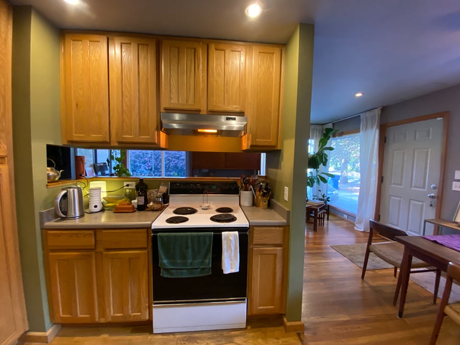 Kitchen looking toward front door. In room through bar area above stove is where I teach my class Tuesday / Thursday mornings 10 am on zoom