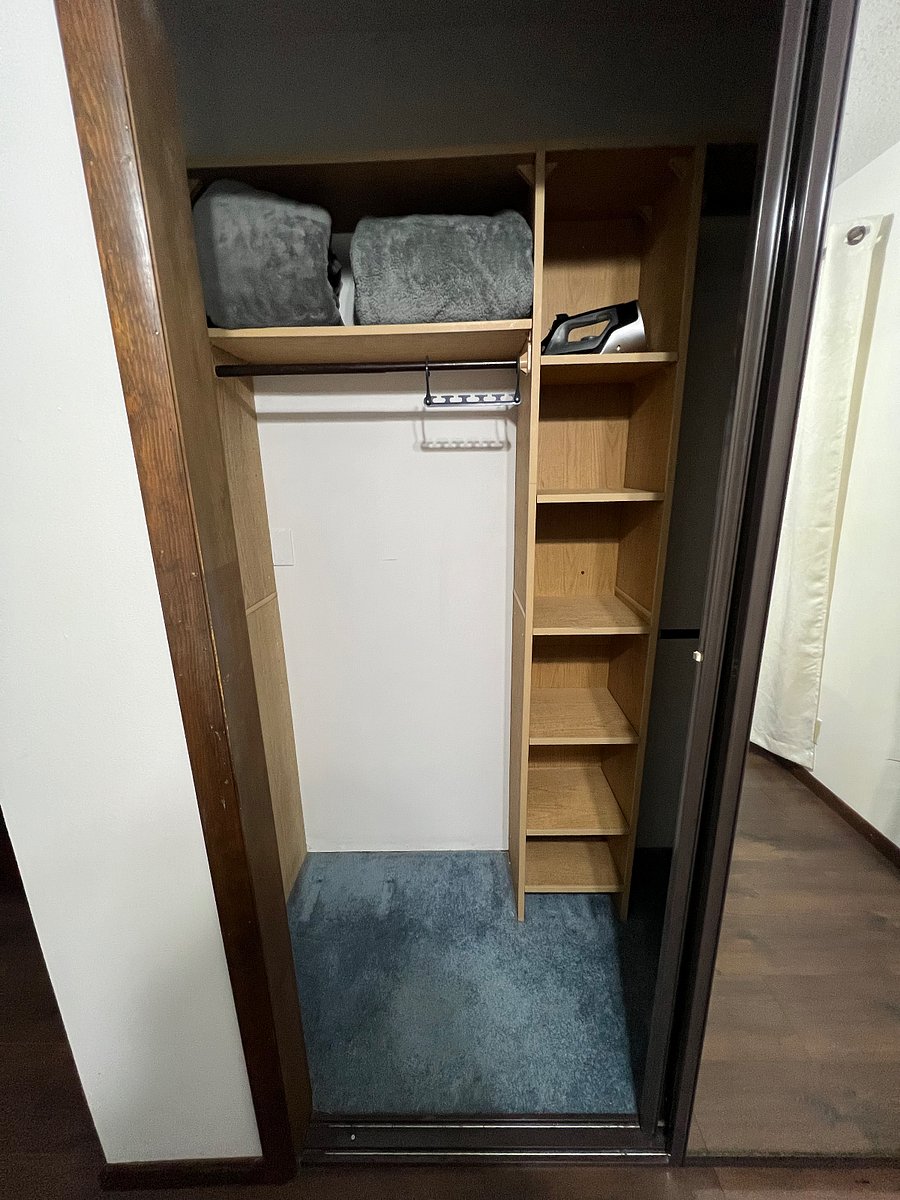 Closet of primary bedroom - Sliding mirrored doors, shows half the closet here