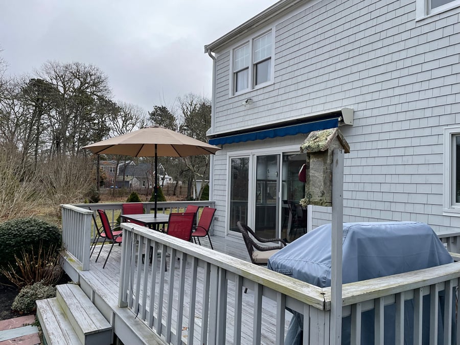 Large deck with lots of seating and gas grill.