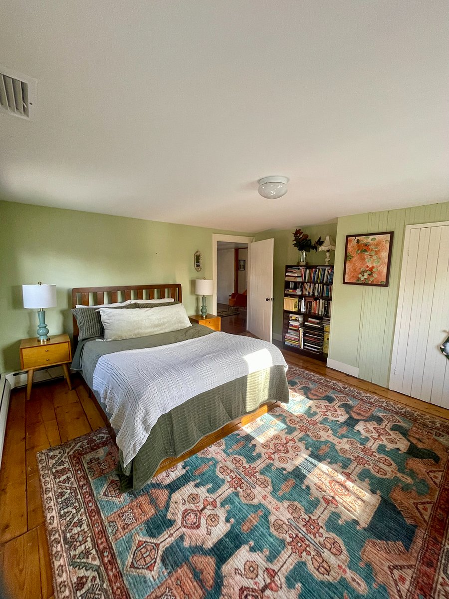 Queen bed with bureau drawers under mattress for extra storage.
