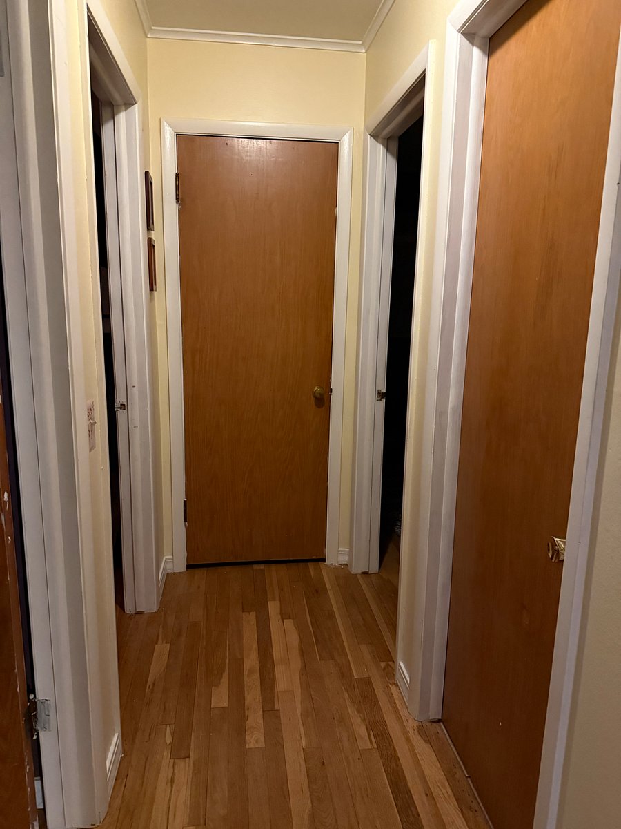 This is the hallway with our bedroom to the left and the rental room to the right. The shared bathroom is on the right with the closed door.
