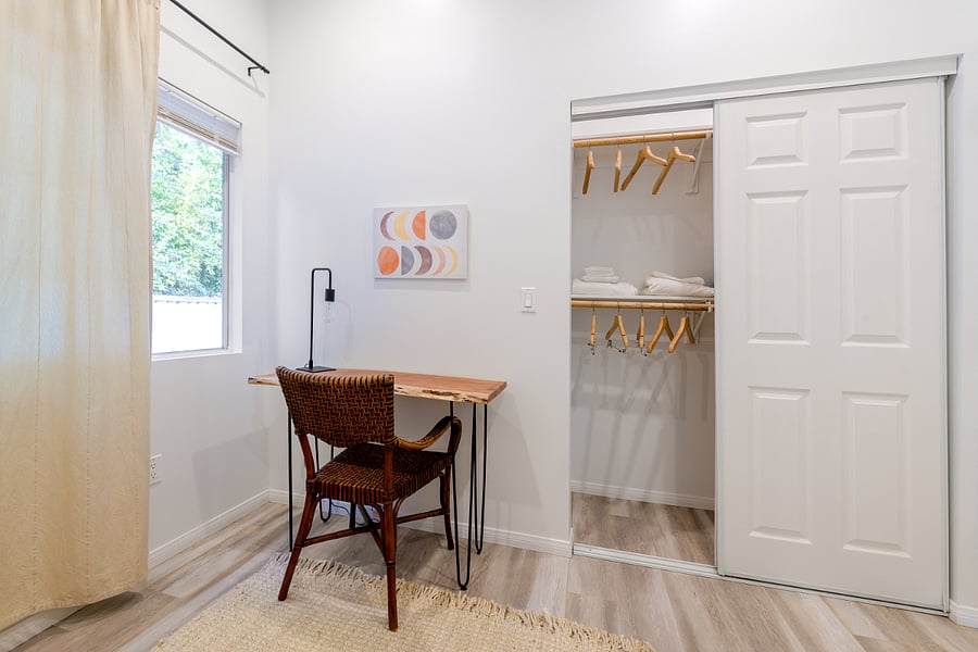 Your creative corner awaits a sleek work desk with a peaceful garden view, lined by trees that whisper good vibes. Perfect for work, chill, or daydreaming!