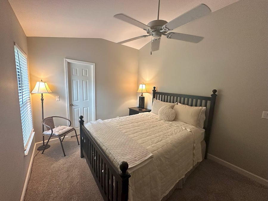 Guest bedroom with Queen bed with walk-in closet. 