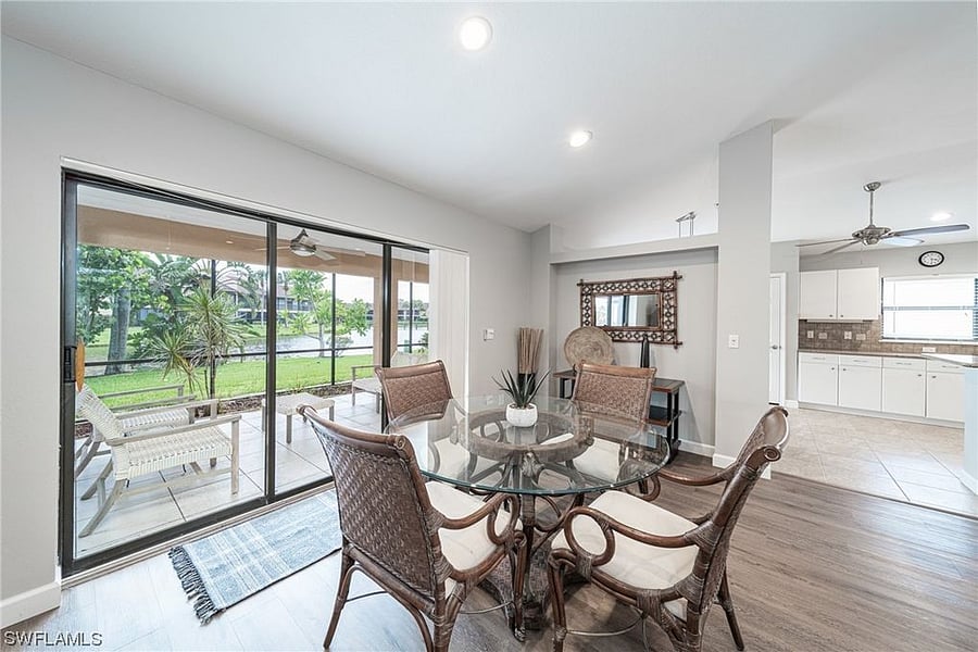 Dining area and access to Lanai.  The 3 sliders open completely.  There is a 2 door slider access from the kitchen as well. 