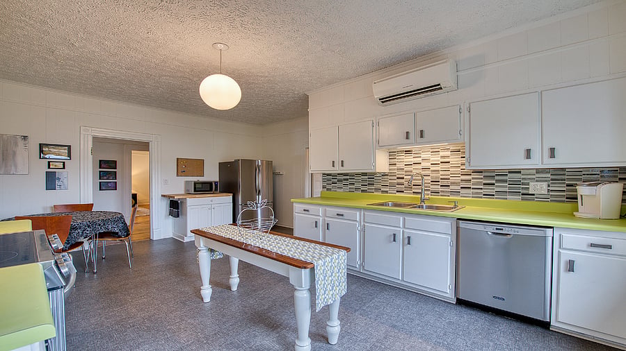 Kitchen well equipped, includes stainless appliances and steps out to patio with outdoor dining, propane grill and mountain views.