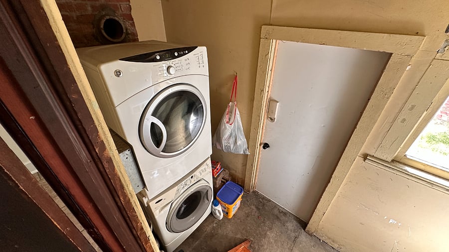 Onside shared laundry room, accessed from outside.