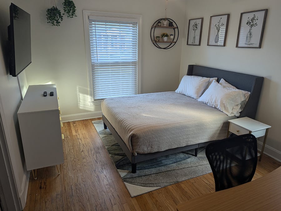 Queen bed with electric lift desk.