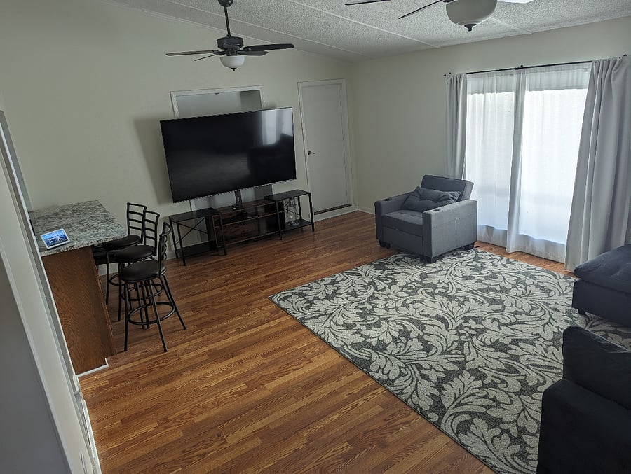 Living room with access to back deck.