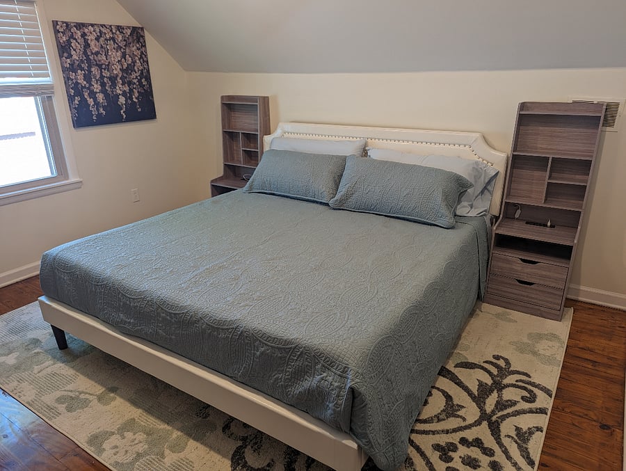 Upstairs king bed with memory foam mattress and walk in closet.