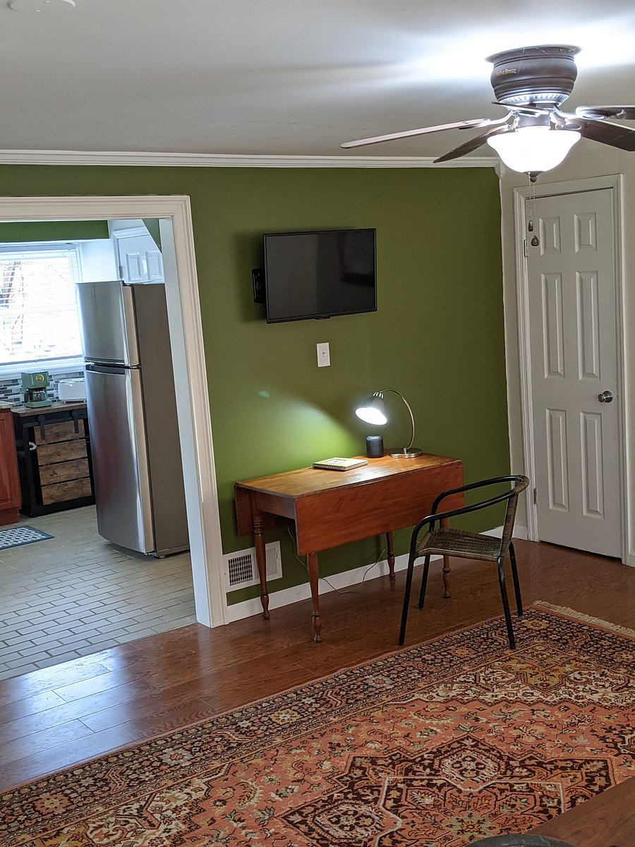 Work space and view from couch with adjustable TV w/ streaming services.
