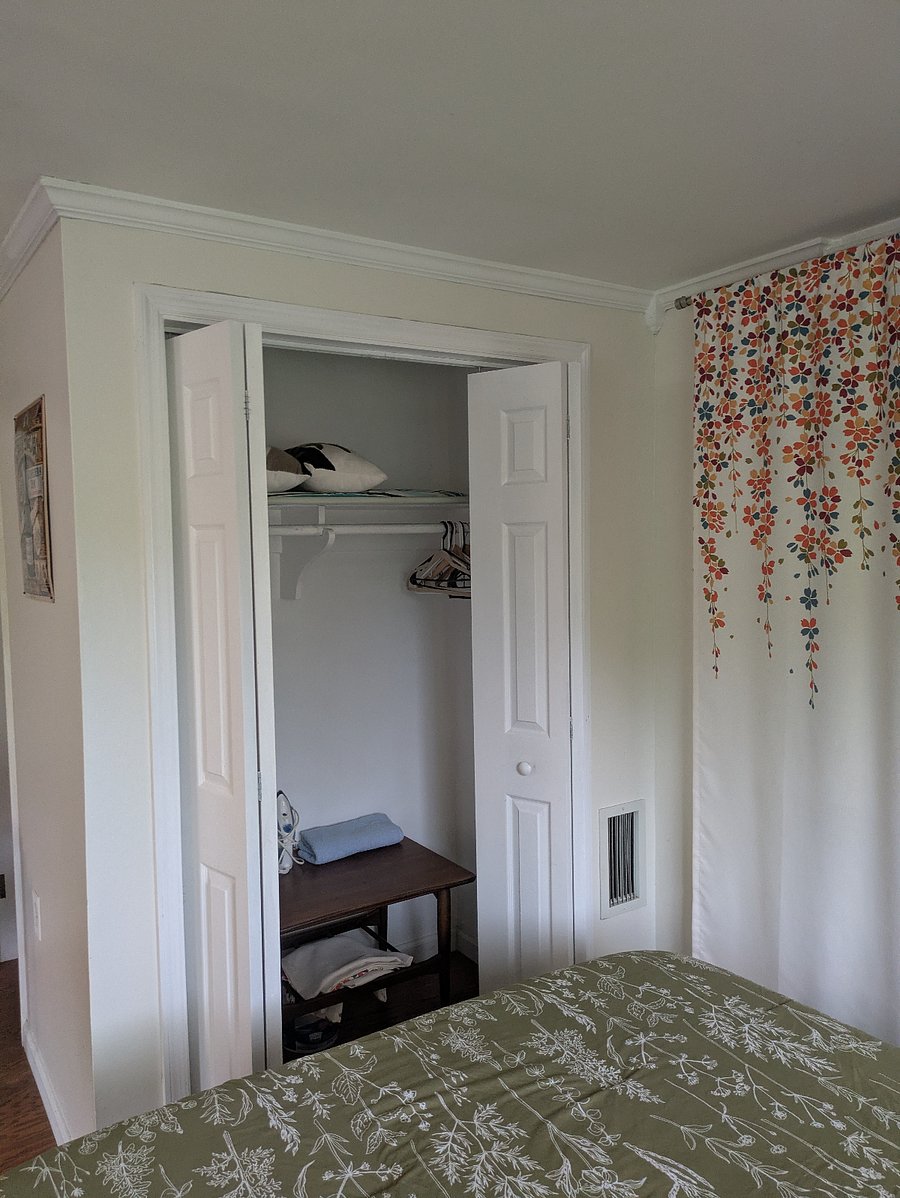 Closet in front of bed.