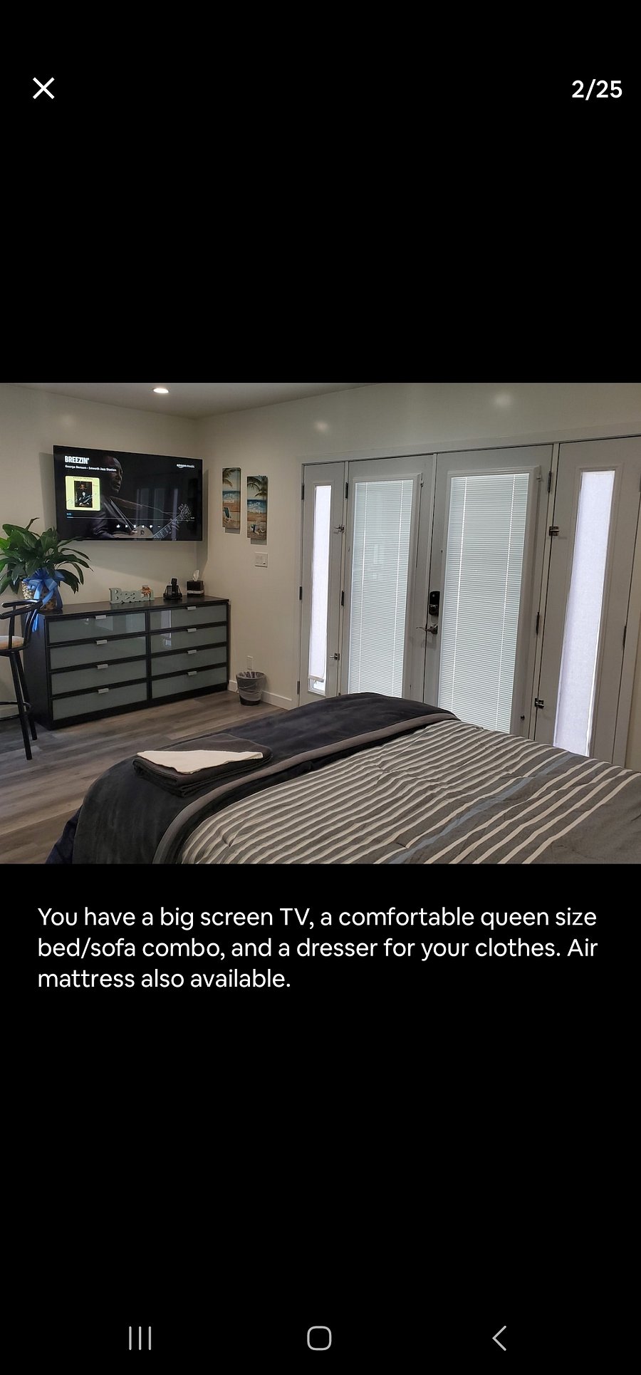 A comfortable queen size bed, full screen TV, and an eight-drawer dresser.