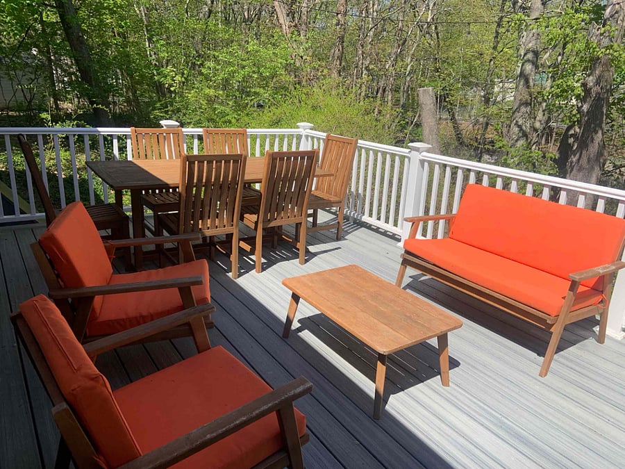 Spacious back deck overlooking peaceful wetlands, where you'll see ducks floating by and hear birds singing. Please be mindful the wetlands water goes up and down through the season. The back yard is not fenced in.