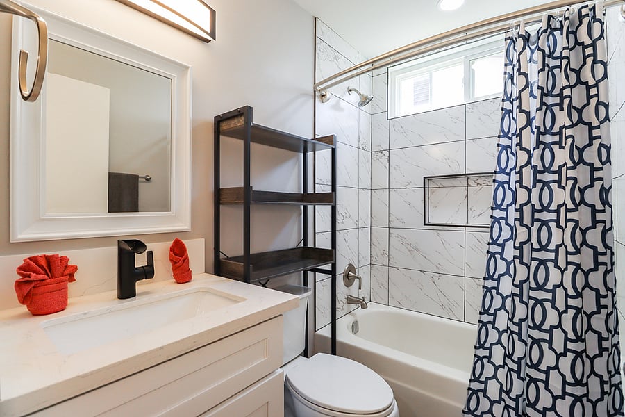 Enjoy the convenience of a well-appointed bathroom with a stylish vanity and a shower-tub combination.